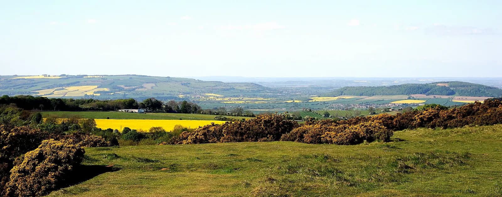 Wide view from Cleeve Common over Cotswold farmland and villages